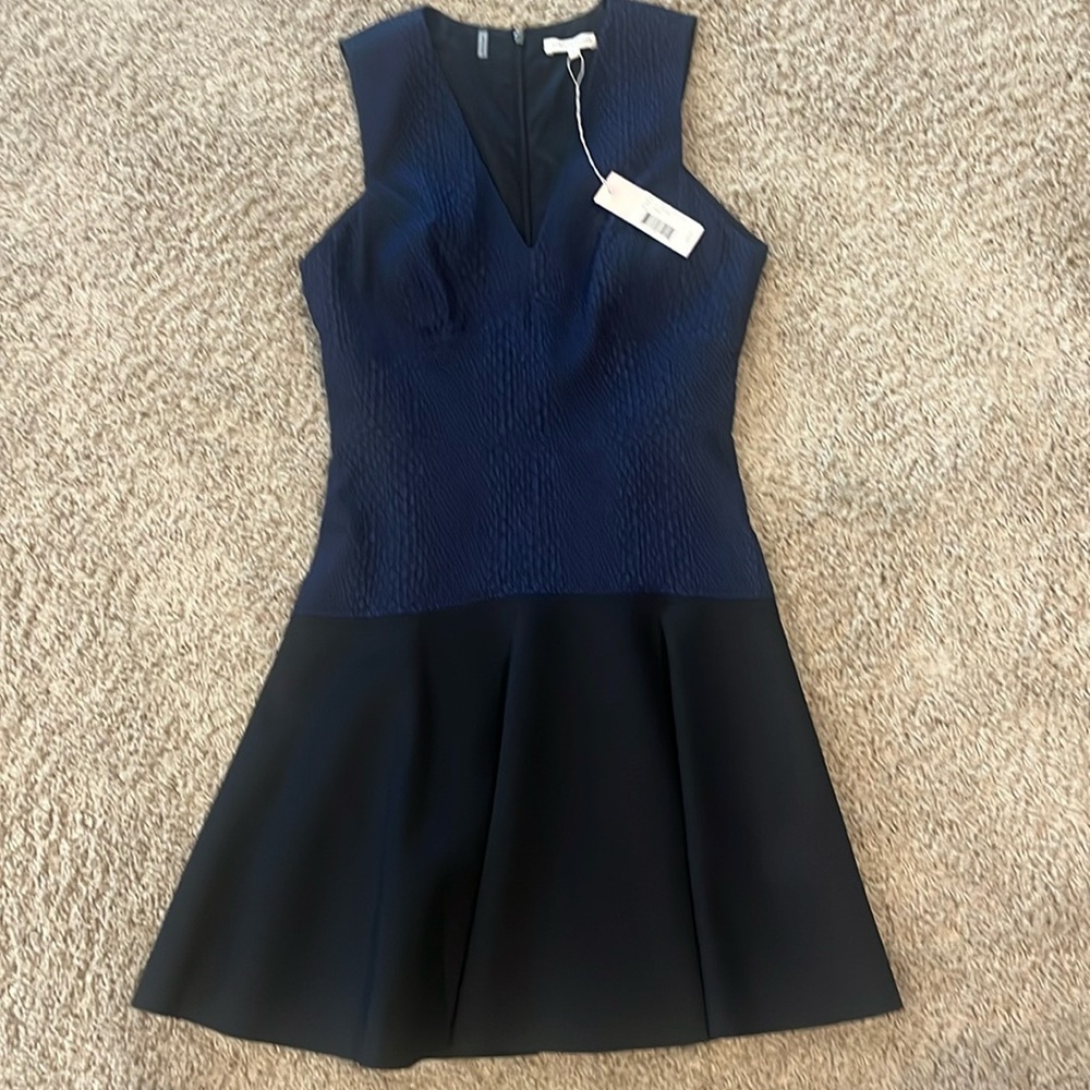 Sleeveless V Neck knee length dress. Brand new with tag.